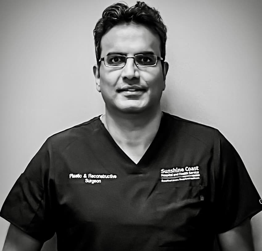 Dr. Chandan Jadhav looking into microscope